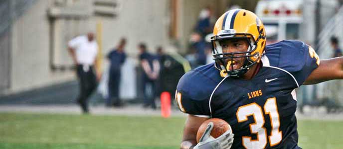 A football player running the ball