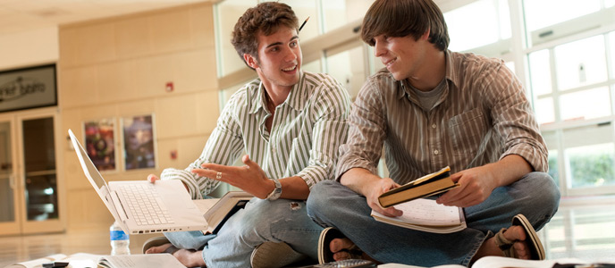 Two students working on school work
